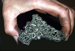 A fragment of a black smoker chimney collected from the Kairei Vent Field. Hydrothermal fluids with temperatures of 554°F (308°C) flowed through the many small channels lined with glittering crystals of pyrite (iron sulfide).  