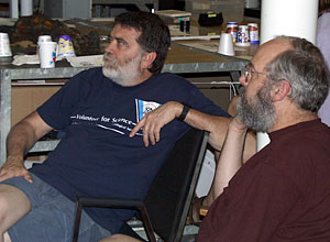 Chemists Marvin Lilley and Bob Collier watch live footage of the new hydrothermal vent discovery in the main lab.  
