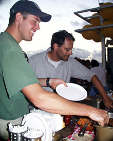 DSOG team members Pete Collins (left) and Andy Bowen enjoy tonight’s cook-out. 