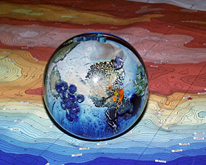 One of Josh Simpson’s Planets sits on a bathymetric map of the Central Indian Ridge. 