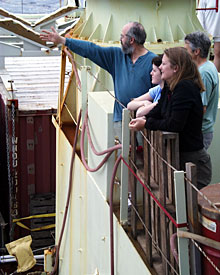 From Knorr’s 01 deck, Bob Collier, Jesse Philley, Dan Fornari and Dorothee Gotz watch the ship’s crew retrieve the elevator after it surfaced. Bob points to the elevator’s location.  