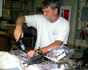 Chemist Eric Olson spent the day taking apart sampling bottles and packing for his trip home to the University of Washington in Seattle. 