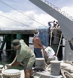 At noon today we cast off the lines from the pier at Puntarenas and headed out to sea. (from left) Joe Ferris, the Third Mate, Tim Hill, Able Seaman, and Jim Pearson, Able Seaman man the stern lines.  