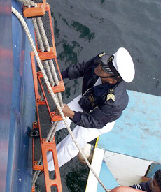  An Ecuadorian customs official boards R/V Revelle from a panga, water taxi, to clear us for entry into the Gal&aacute;pagos. Once cleared we can all go ashore.  