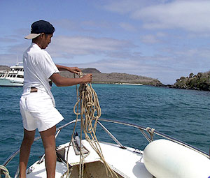  The boat captain’s son handles the anchor line as we enter Santa F&eacute; Bay where we snorkeled today.  