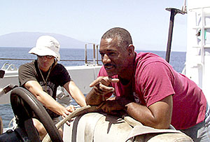 Lorna Allison and Butch Harty make repairs on the ship’s workboat, helping to ensure that every part of the ship is in working order when it is needed.  