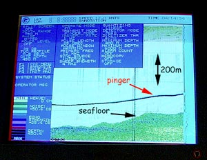  This is the pinger display in the Computer lab, where all the dredge operations take place. The pinger trace tells us how far the dredge is above the seafloor. The black line shows where the pinger is and the green is the sea floor. The pinger is mounted 200 meters above the dredge. Using the scale bars we can determine if the dredge is on the bottom. 