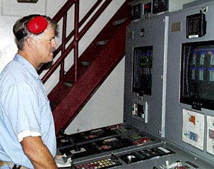 Steve St. Martin, 2nd Assistant Engineer, monitoring computers which run the ships engines in the Engine Control Center.  