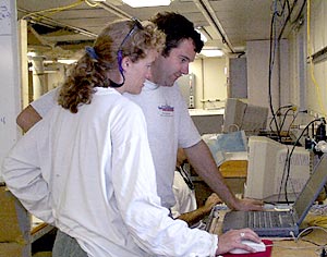  Karen Harpp and Josh Curtice look over the days dredging log sheet. All the information entered into the spreadsheets must be accurate so we know where all the rocks come from and what samples will need to be analyzed once we get back to our shore-based laboratories. 