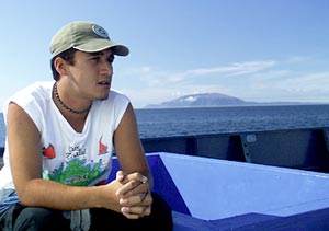  Jules Paredes, an observer from the Gal&aacute;pagos National Park, enjoys the beautiful weather as he sits by the pool out on the fan-tail. 