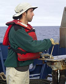 Joe Licciardi operates the A-frame as the dredge is recovered early this morning.  