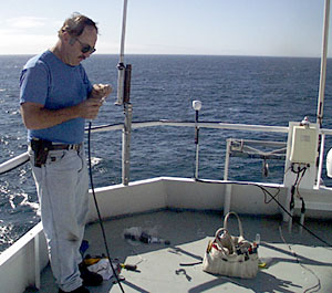  ‘Big Al’ Luallin, Marine Electrician, installs a new radio mast to improve our communications with land. 