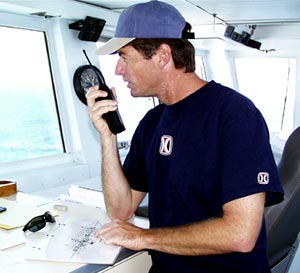  Captain Chris Curl directs the fire and boat drill from the bridge. 