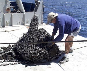  Dan Fornari empties a full rock dredge onto the fantail. This one had over 500 pounds of rocks in it. 