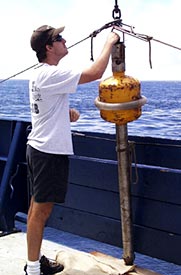  Todd Ericksen makes last minute preparations to the newly made sediment corer he constructed during the past few days. 