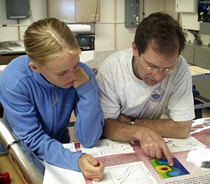  Jenny Engels and Mark Kurz review images of Fernandina. 