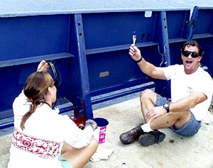  Lorna Allison, Ordinary Seaman, and Jim Pearson, Able Seaman, paint the bullwark. 