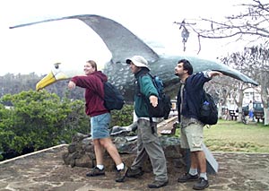  Kate Buckman, Joe Licciardi and Joe Ferris ‘fly’ with the statue of the albatross at Puerto Ayora dock.  