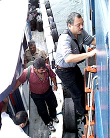  Customs and immigrations officials come on board. 