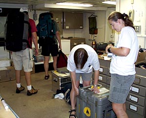 Last minute packing continues, Kate Buckman (right) and Rhian Waller pack away another case as Alberto Saal and Rob Otto make their way outside with their luggage. 