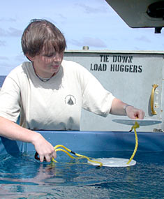 Graduate student, Rhian Waller, uses the ship’s “pool” to test the design of markers that will be left on the seafloor at hydrothermal vents sampled by Alvin.