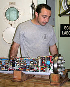 Alvin Pilot Tony Tarantino inspects the motor controller for the hydraulic pump motor, which provides power to move Alvin’s manipulators.