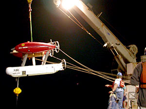 ABE is hoisted over the side and into the ocean to map the Rose Garden hydrothermal vent site.