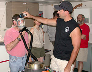 Co-Chief Scientist Steve Hammond tries out Emergency Breathing Apparatus