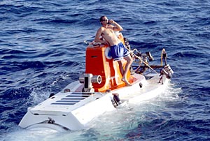  Ordinary Seaman Uriel Carpenter orders a pizza to go! Actually, he is talking via telephone to Alvin&rsquo;s occupants in its sealed sphere as the sub waits to be recovered this evening.