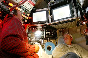  Co-Chief Scientist Tim Shank and Alvin Pilot Phil Forte share a joke inside Alvin&rsquo;s personnel sphere, which is only 7 feet in diameter. 