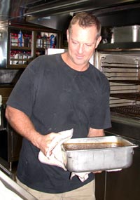 Steward Carl Wood prepares lunch. Cooking three meals a day for 54 people is no easy feat—but the food is delicious.