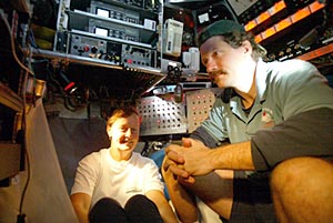  Susan Humphris and BLee Williams get comfortable during Alvin’s 90-minute descent to the seafloor. It’s a long commute to work!