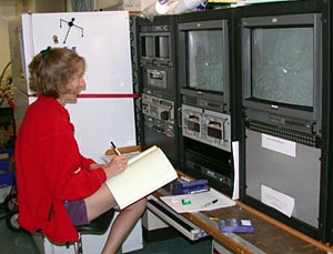  Stace Beaulieu finishes reviewing the videotapes from all the Alvin dives yesterday.