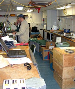  Dana Yoerger and Al Bradley finish backing up ABE data on their computers amid the chaos of packing.