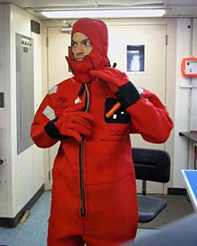 Dive and Discover writer Joe Appel, after yanking on his &ldquo;gumby suit,&rdquo; an immersion suit capable of keeping someone warm and afloat for some time, depending on conditions. Everyone on board stores one of these suits in his or her berth.  