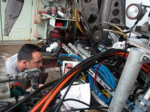 Alvin Pilot Anthony Tarantino examines the submarine in advance of its scheduled dive the next morning.  