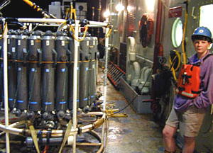 Scientist Rhian Waller prepares the conductivity, temperature, depth apparatus, or CTD, for deployment. The CTD can calculate water density from those three parameters. (Conductivity is essentially salinity, or how salty the water is; density is calculated using temperature and salinity). The CTD is also useful for measuring changing water currents above and around the seamounts.
