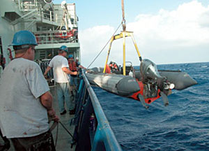 The inflatable Avon is responsible for transporting the swimmers to Alvin. During a pre-dive test, crew members found steering trouble with this boat. Some crew members speculated that the damage was done when high swells knocked the Avon into the ship's hull during launch.  
