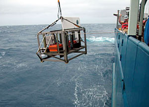 The towed camera is lowered into the water.