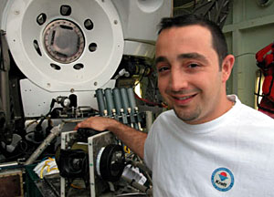 Alvin Pilot Anthony Tarantino performs additional maintenance checks on the sub. He's eagerly waiting for diving to begin again when the weather clears. 
