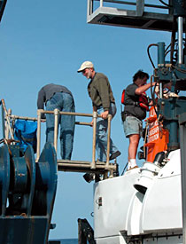 Biologist Jon Moore exits the sub after his first dive. Little does he know what lies in store at the bottom of that step ladder.