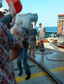 Although you can't see much of him, that's Jon Moore again, face to face with a longtime Alvin tradition: After your first dive, you get doused with ice water as if you're a Super Bowl-winning coach.