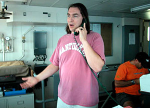 Chief Scientist Jess Adkins in the "top lab", on a satellite phone call to the Boston Museum of Science, where hundreds of students were listening. The phone call was patched through to Alvin who was on Muir Seamount. The students asked questions, and the scientists in Alvin responded and gave a running commentary on what they were seeing.  