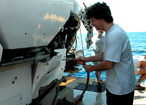 Chief Alvin pilot BLee Williams hoses down the sub with fresh water immediately after it's brought on board. While Alvin is a rugged piece of equipment, it's also complicated and requires constant upkeep.  