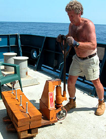 ABE technician Rod Catanach moving weights that will go on Alvin. The sub drops weights on the ocean floor each time it ascends from the bottom. 