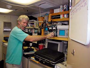 Communications manager Tim Logan in his office. Tim is responsible for all communications that go back and forth between ship and shore. This includes communicating with other ships, satellite communications, as well as a lot of electronics on board. 