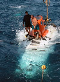 Swimmers Mark Spear, left, and Jerry Graham ride Alvin back to the ship after its dive. They didn&rsquo;t jump off and swim this time, however, since they&rsquo;d just spotted a swordfish eyeing them with interest.  