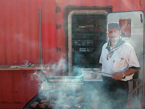 Al, on fire. Ship cook Al DaLomba, through the smoky haze of the cookout. A lot of us truly couldn’t remember when we’d had better steaks. 