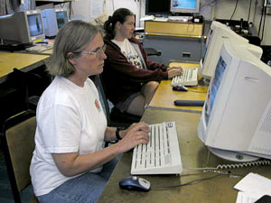 Biologists Susan Mills and Kate Buckman in the main computer lab, going through their e-mail. E-mail to and from the ship is sent via satellite. Unlike onshore, where an Internet connection can be “always on,” there are three bulk transmissions per day: morning, noon, and evening. We have to keep our e-mails short as satellite time is expensive. In addition, there are two SeaNet transmissions per day, which are capable of sending and receiving larger collections of data such as the Dive and Discover Web site update. 