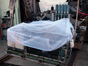 This net was built quickly after we received word from Alvin that today's haul was especially large. Upon surfacing, there's the risk of samples spilling out of the collection basket without such a net. 